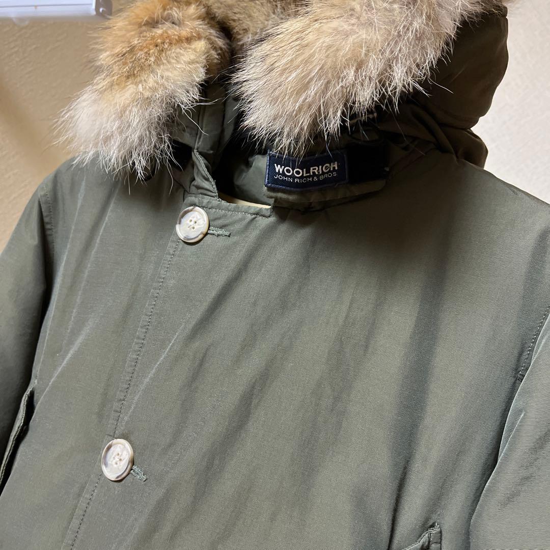 1/31まで。WOOLRICH オリーブ アークティックパーカー