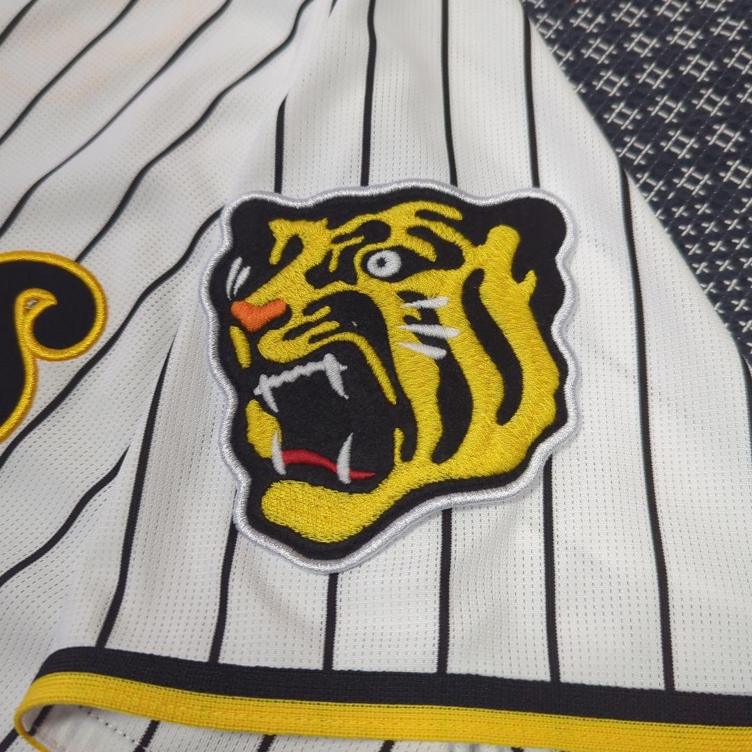 阪神タイガース　チャンピオン　エンブレム付き　ユニフォーム　佐藤輝明【Ｌサイズ】