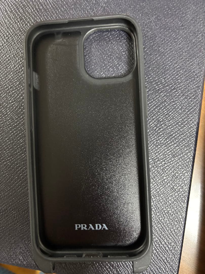 PRADA ストラップ付きiPhone15ケース ライトブルー