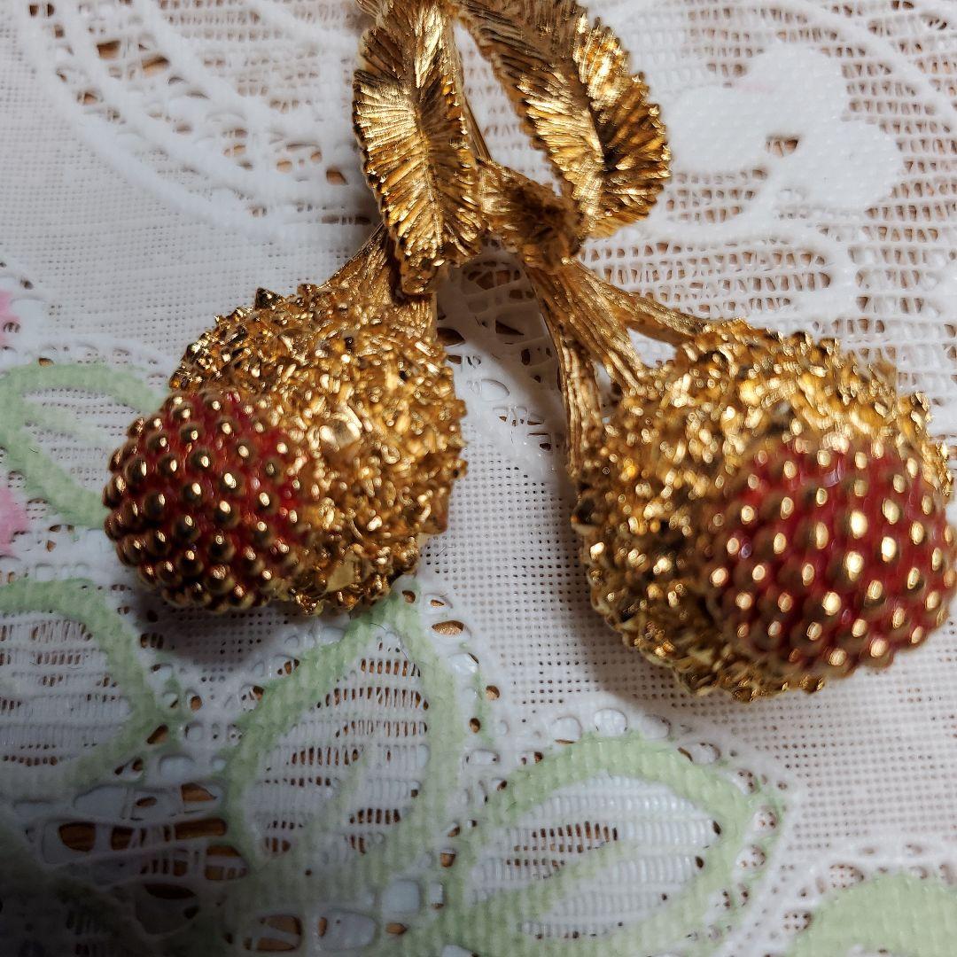 Carven 金色の花束ブローチ