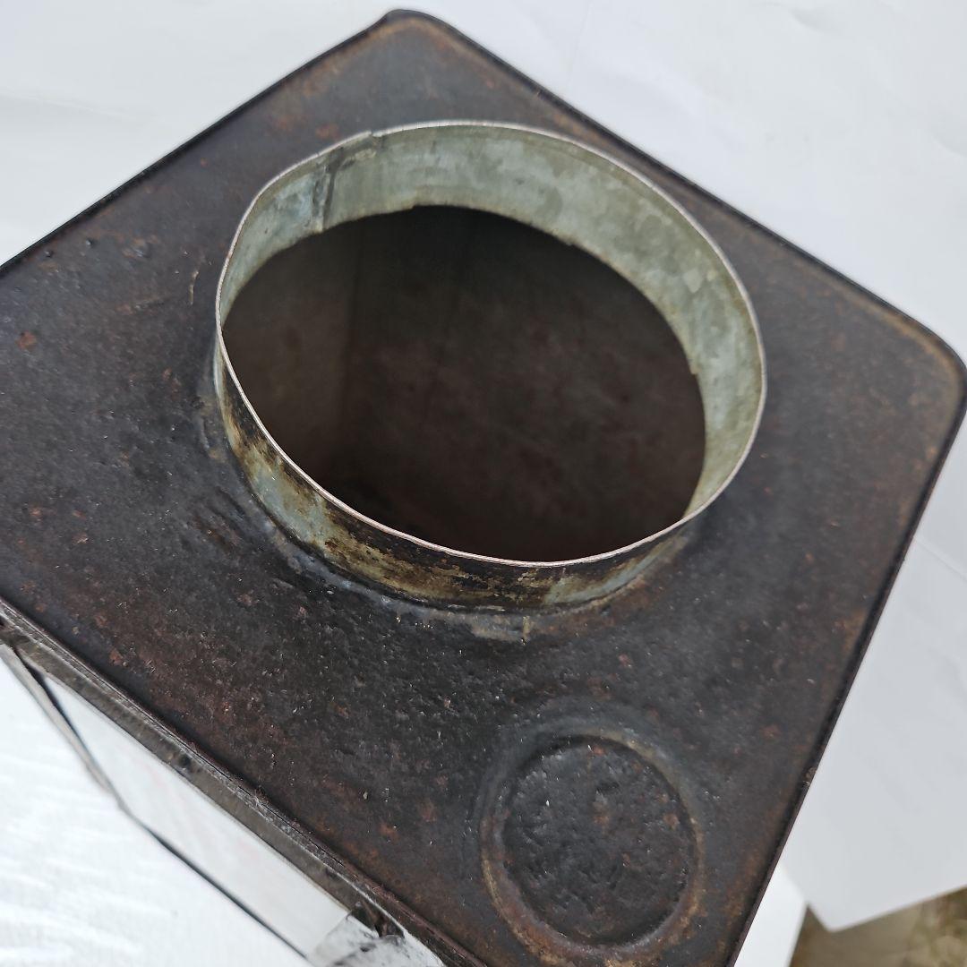 せんべい容器 黒と赤の金属製