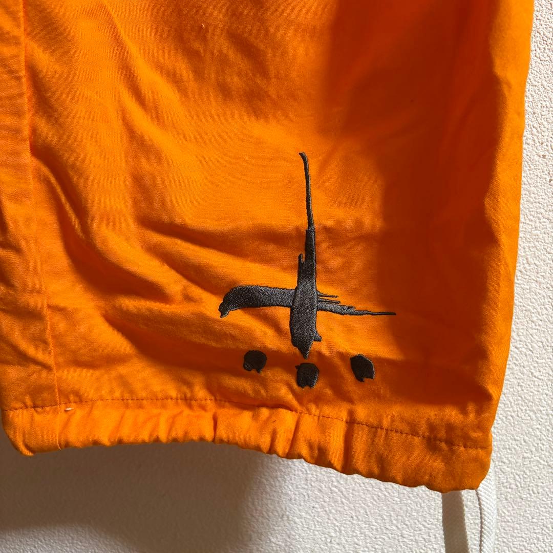 オレンジ カーゴパンツ サイドポケット付き