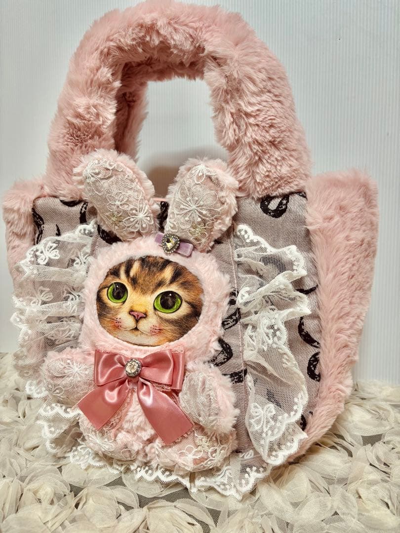 お取り置きです。コヤンイサムチョン　ピンクファのリボンゴブランころりんバッグ