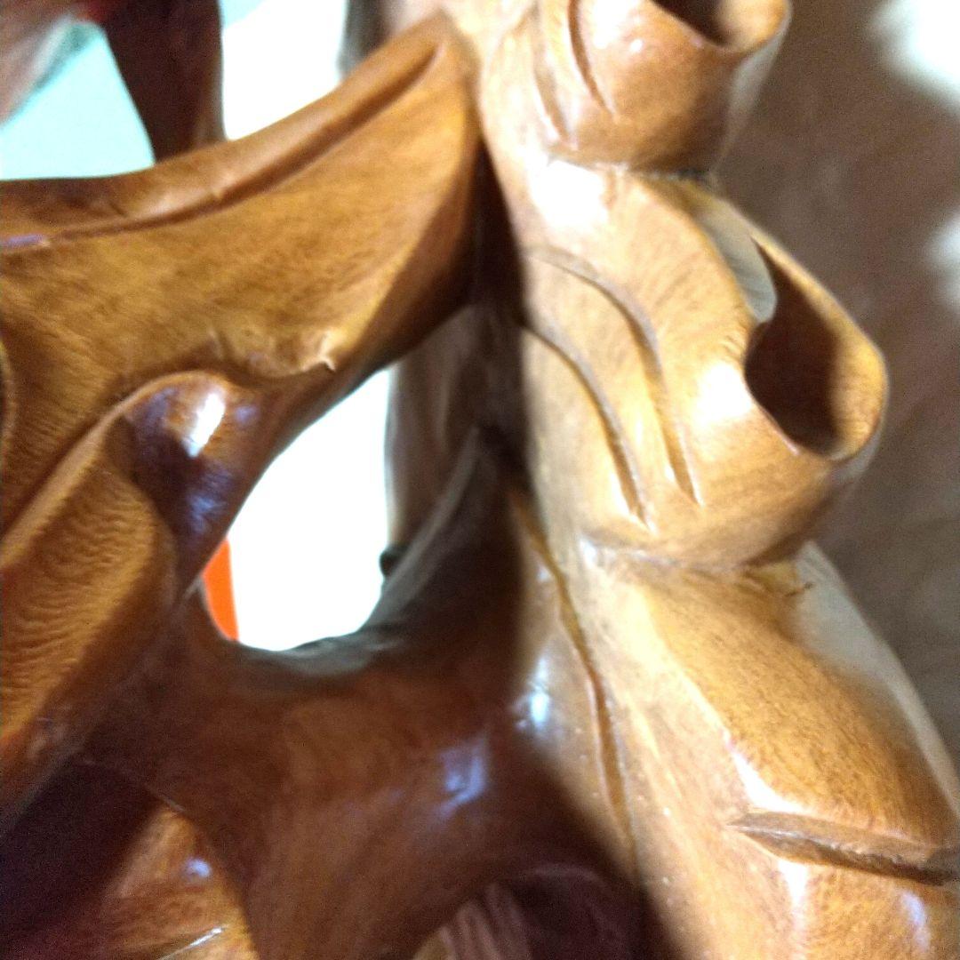 木製布袋の置物で一枚木彫りの高さ25cm長さ52cm幅15cm重さは約５キロです